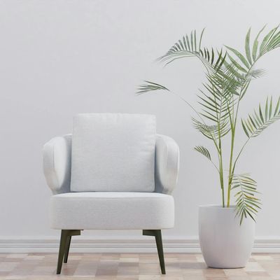 A bright hotel room interior with a large window and simple wooden furniture.